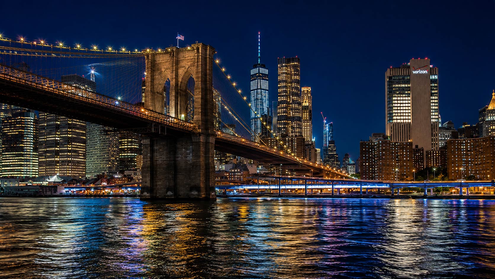 Couple enjoying Brooklyn Bridge views during a romantic NYC cruise