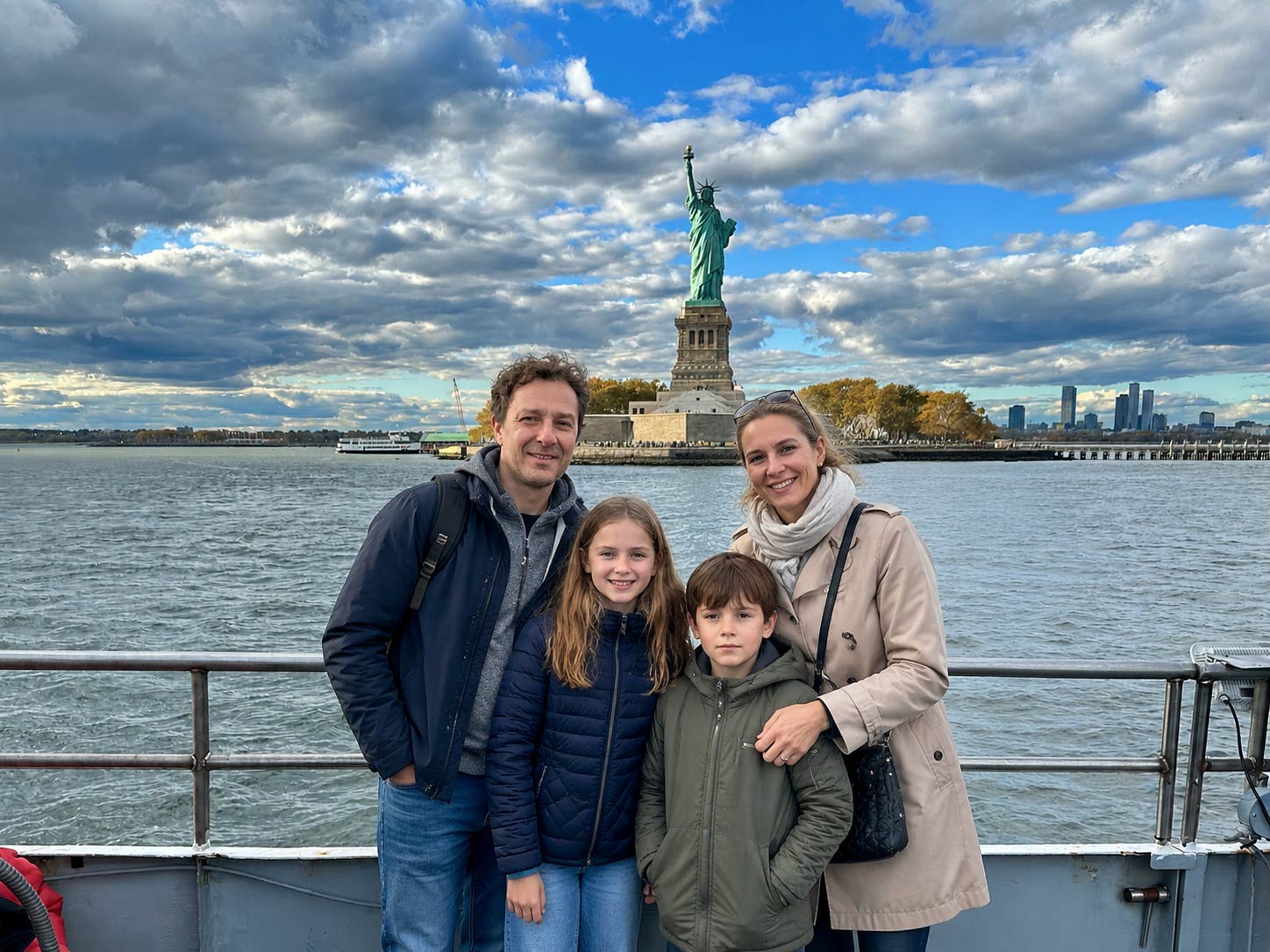 Family enjoying New York skyline views from the harbor