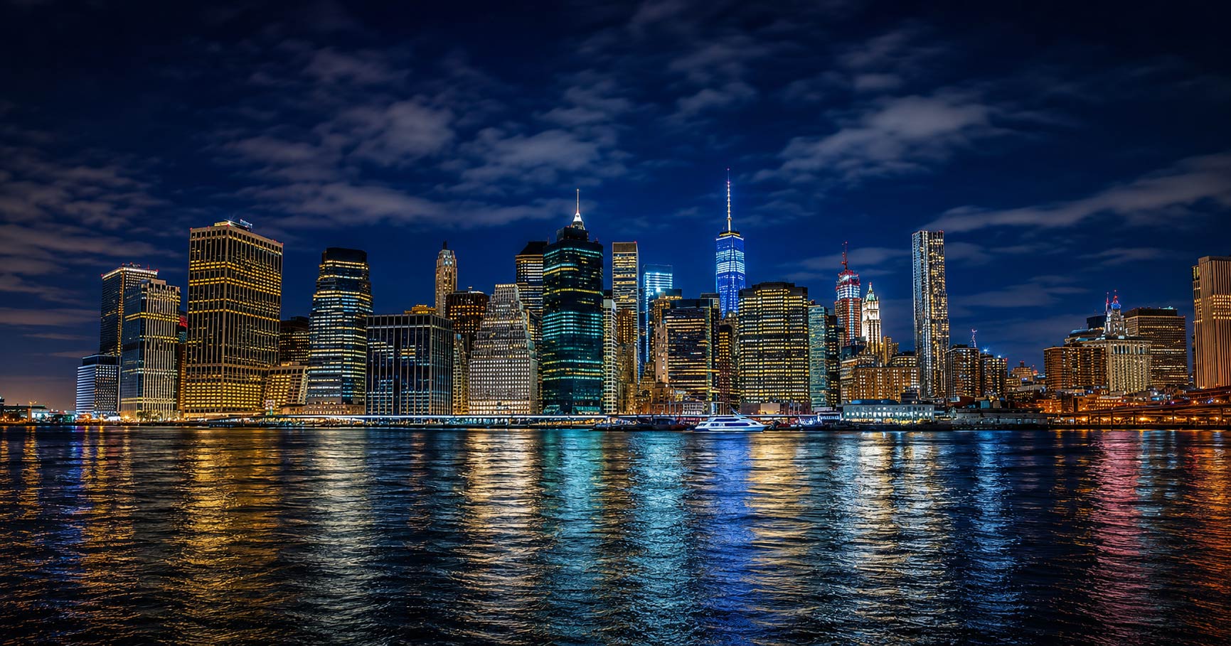 Couple taking romantic skyline photos during a New York Harbor cruise